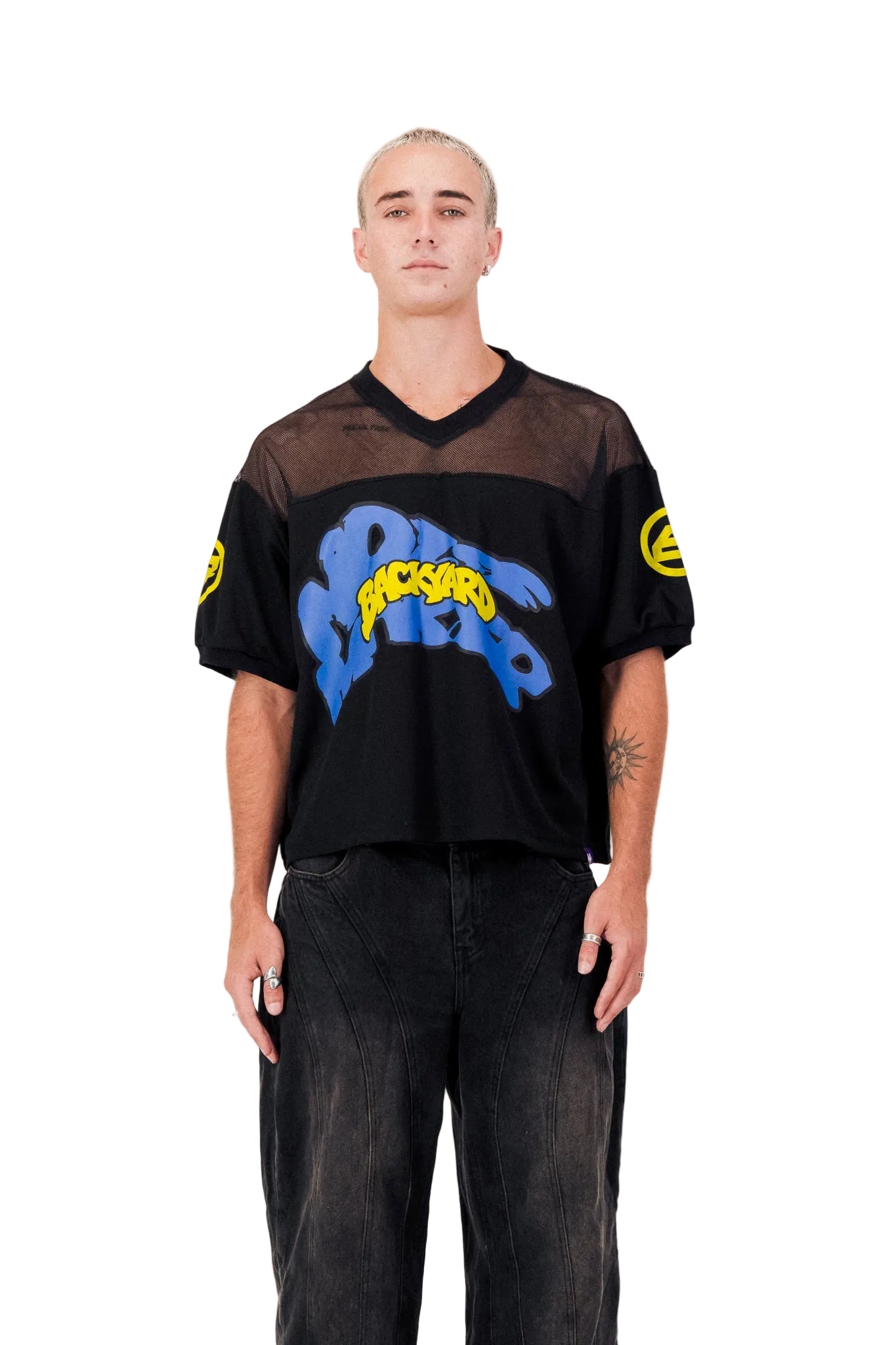 Person wearing a black jersey with blue and yellow text on a white background